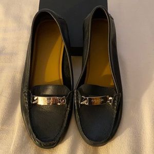 Slightly worn women’s Coach flat shoes